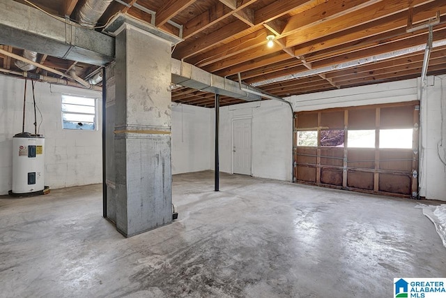 basement featuring water heater and heating unit