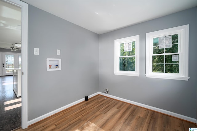 washroom featuring ceiling fan, hookup for a washing machine, and hardwood / wood-style floors