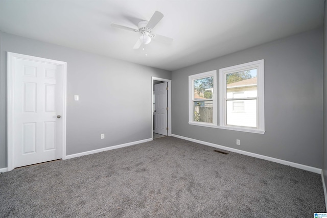 carpeted empty room with ceiling fan