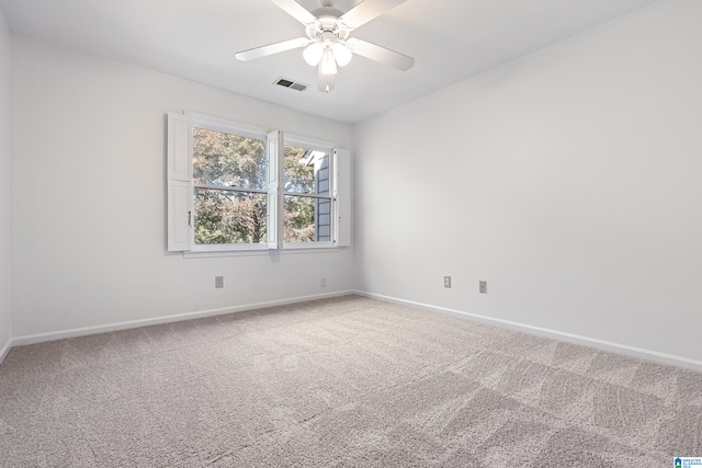 empty room with ceiling fan and carpet flooring