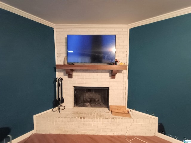 living room featuring crown molding, hardwood / wood-style flooring, and a brick fireplace