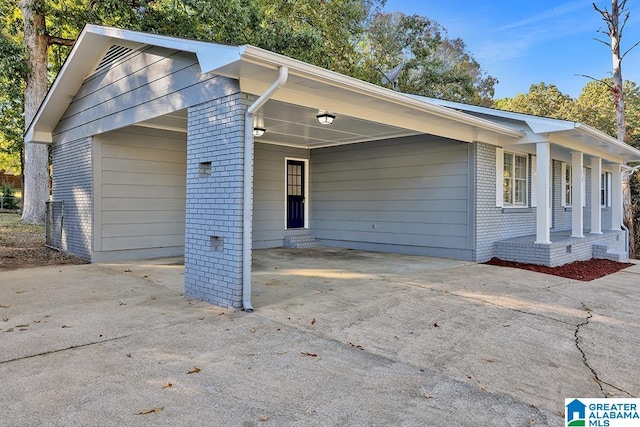 view of property exterior with a carport