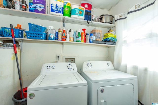 laundry room featuring separate washer and dryer