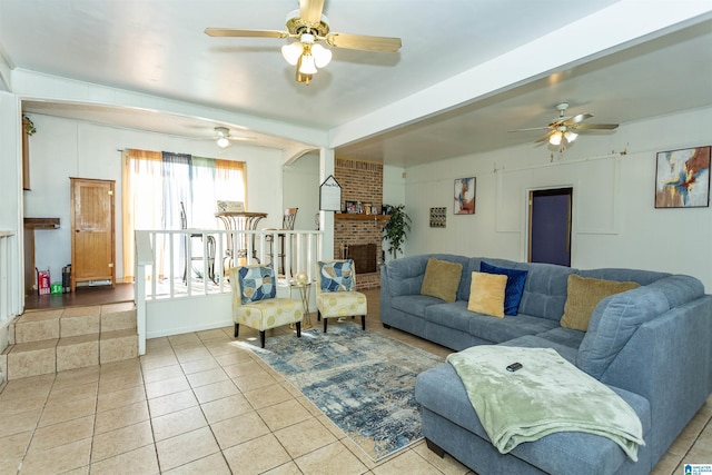405 Depot St, Columbiana, AL 35051 - tiled living room with ceiling fan and a fireplace