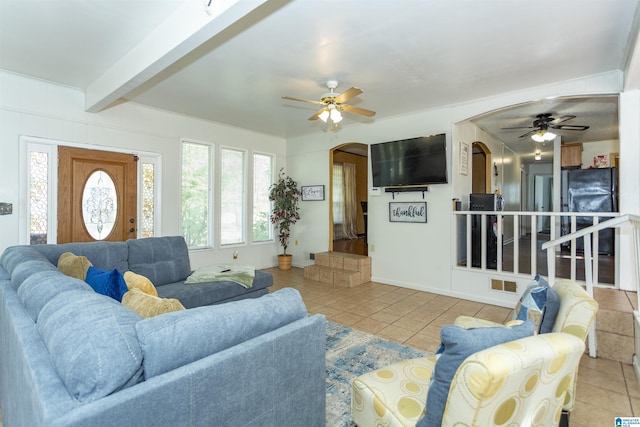 405 Depot St, Columbiana, AL 35051 - tiled living area featuring arched walkways, a ceiling fan, beam ceiling, and baseboards