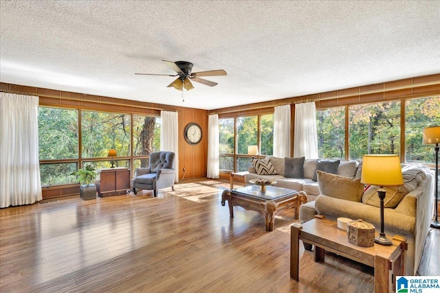 1215 Red Valley Rd, Remlap, AL 35133 - living area featuring a textured ceiling, wood finished floors, and ceiling fan