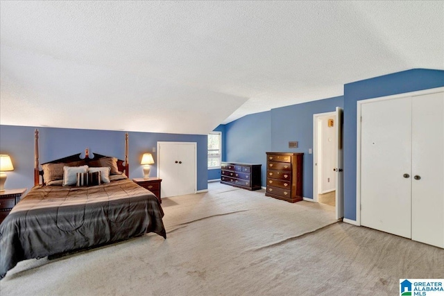 1215 Red Valley Rd, Remlap, AL 35133 - carpeted bedroom with lofted ceiling, a textured ceiling, and baseboards