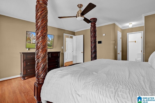 bedroom featuring crown molding, ensuite bathroom, light wood-type flooring, and ceiling fan