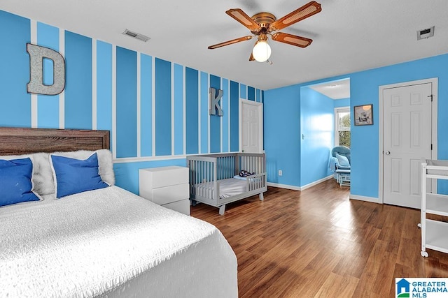 bedroom featuring ceiling fan and dark hardwood / wood-style flooring