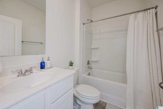 full bathroom featuring toilet, shower / tub combo with curtain, and vanity