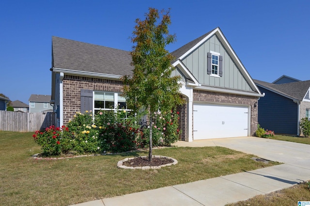 view of front facade with a front lawn and a garage