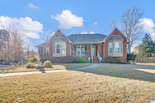 view of front of property featuring a porch and a front lawn