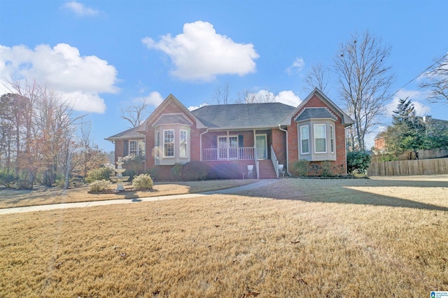 single story home with a front lawn and a porch