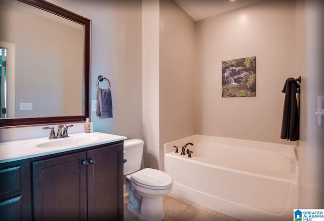 bathroom with toilet, a tub to relax in, vanity, and tile patterned floors