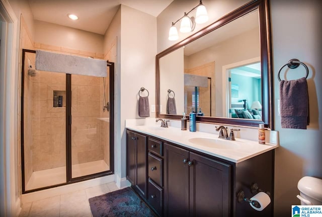 bathroom featuring vanity, an enclosed shower, toilet, and tile patterned flooring