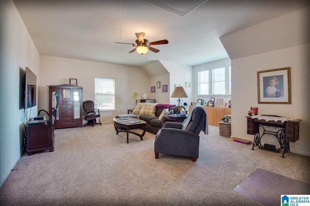 living room with ceiling fan, light colored carpet, and plenty of natural light