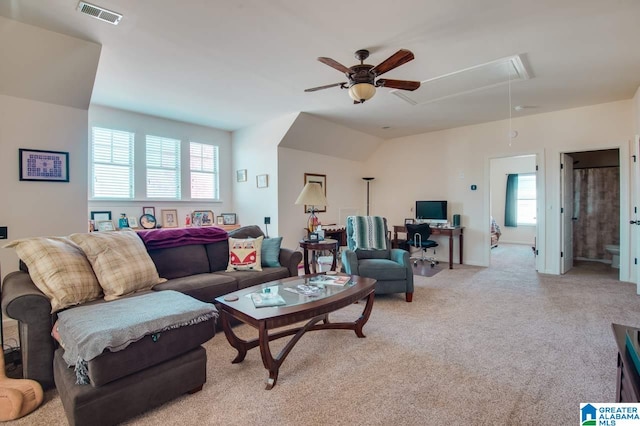 living room with light carpet, a healthy amount of sunlight, and ceiling fan