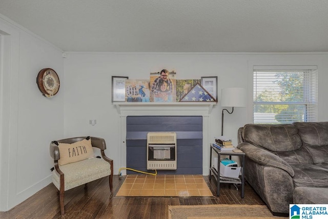 living room with crown molding, heating unit, and dark hardwood / wood-style floors