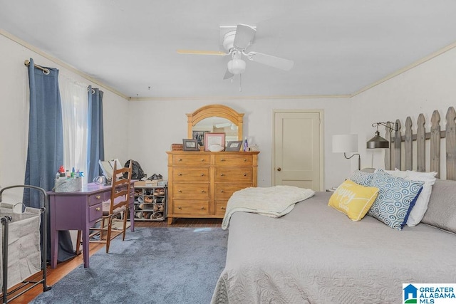 bedroom with ceiling fan, crown molding, and dark hardwood / wood-style flooring