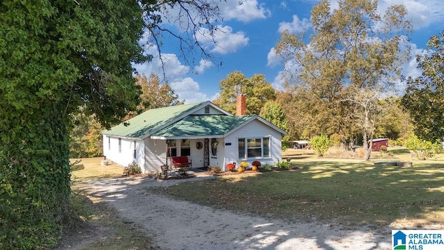 bungalow-style home with a porch and a front yard