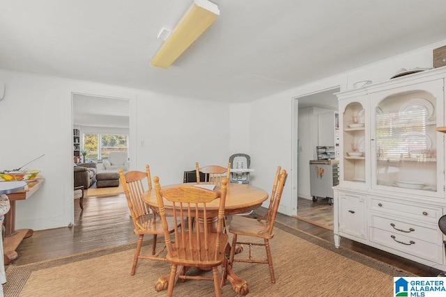 dining area with hardwood / wood-style flooring