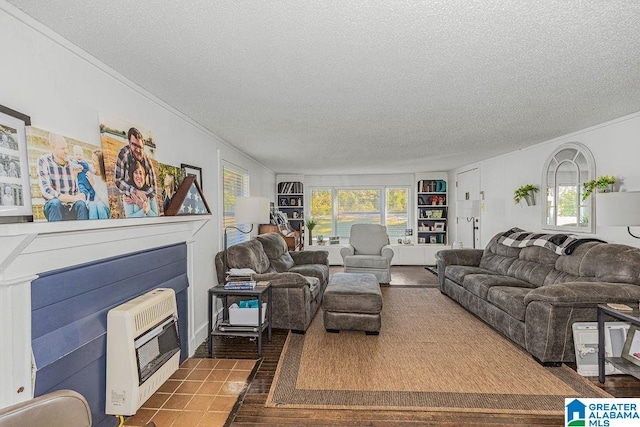 tiled living room featuring a textured ceiling and heating unit