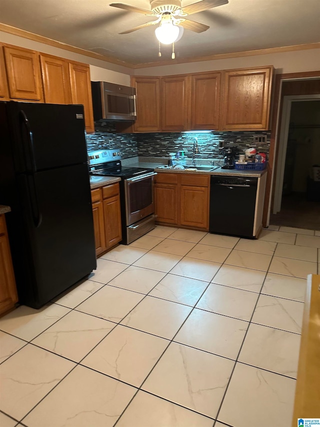 kitchen with backsplash, ornamental molding, sink, black appliances, and ceiling fan