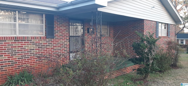 view of home's exterior featuring brick siding