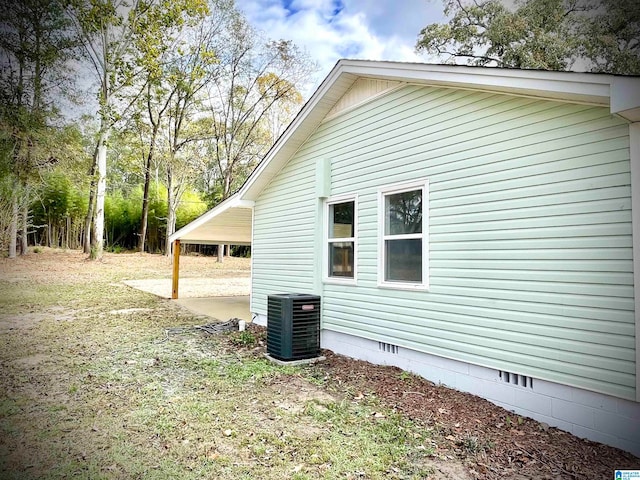 view of home's exterior with central AC unit and a patio area