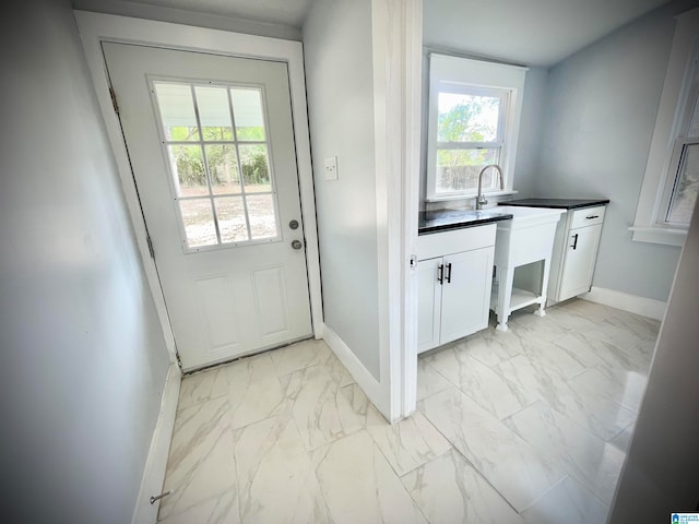 doorway to outside featuring plenty of natural light