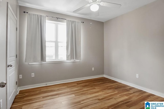 spare room with light hardwood / wood-style flooring and ceiling fan