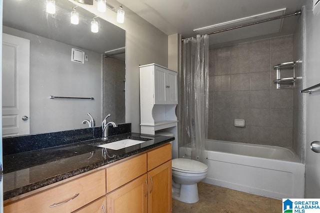 full bathroom with vanity, shower / bath combo, and toilet