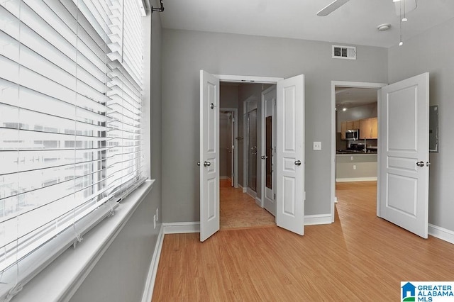 unfurnished bedroom with light wood-type flooring