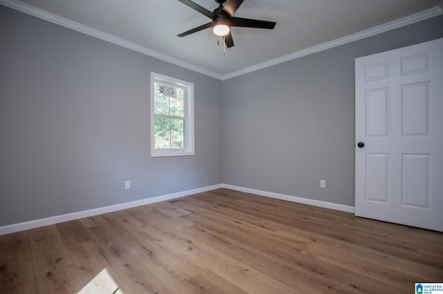 unfurnished room with crown molding, light hardwood / wood-style flooring, and ceiling fan