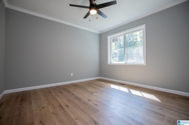 spare room with ornamental molding, light wood-type flooring, and ceiling fan