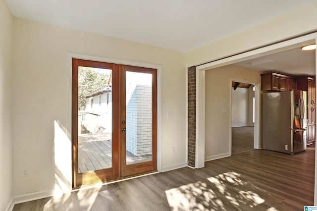 doorway with french doors and dark hardwood / wood-style floors