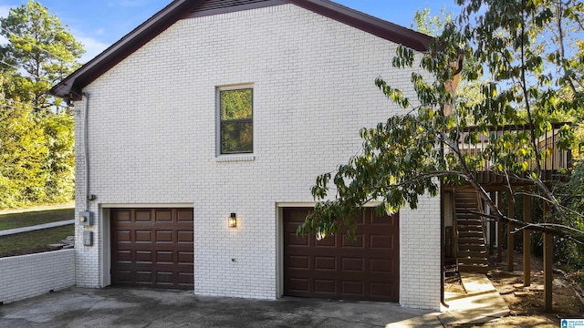 view of side of home with a garage