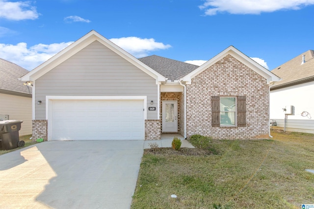 view of front of property featuring a front yard and a garage