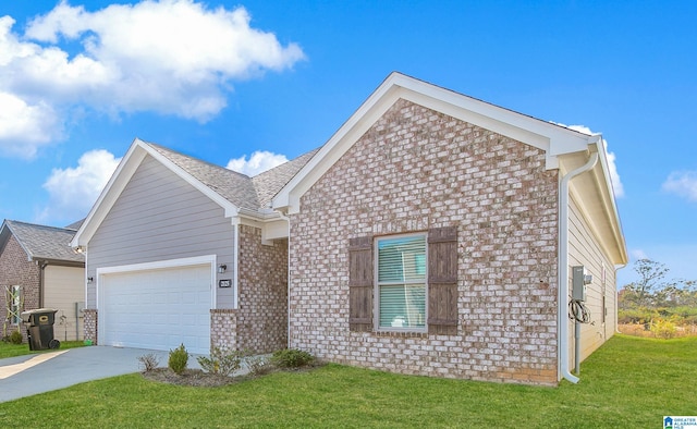 view of front of property with a front yard and a garage