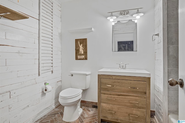 bathroom featuring toilet and vanity