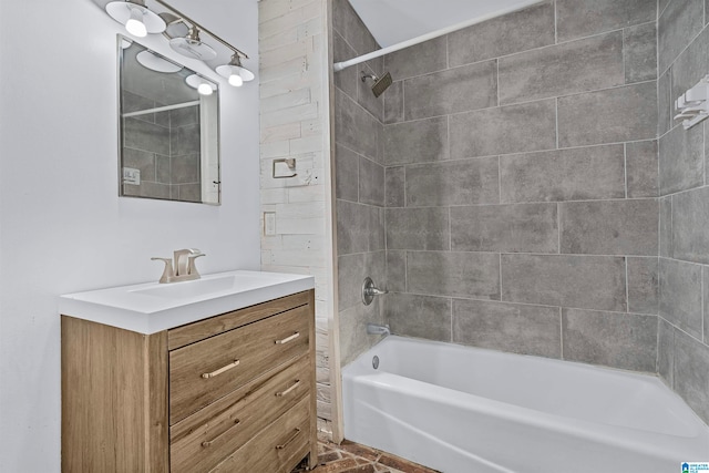 bathroom with vanity and tiled shower / bath combo