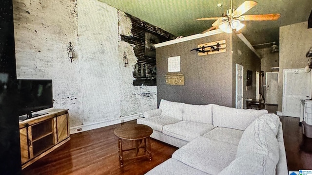 living room with wood-type flooring and ceiling fan