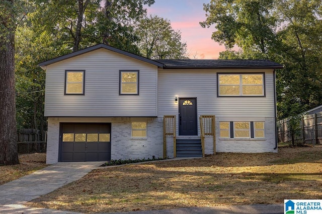 split foyer home featuring a garage