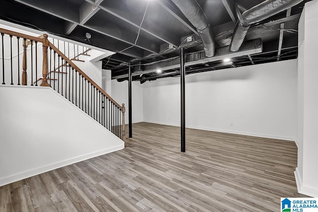 basement featuring hardwood / wood-style flooring