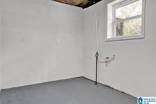 spare room with concrete floors