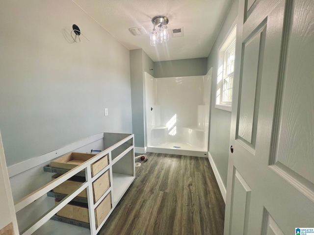 interior space featuring dark hardwood / wood-style floors and ceiling fan