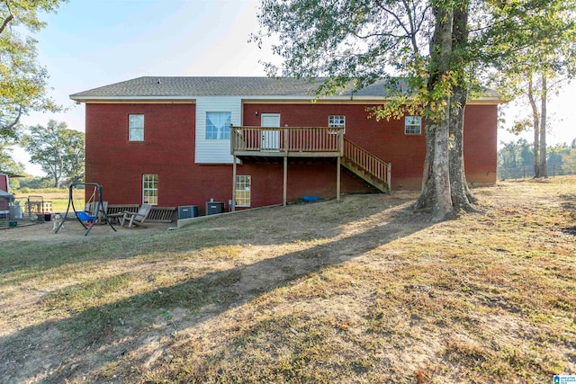 rear view of house featuring a deck