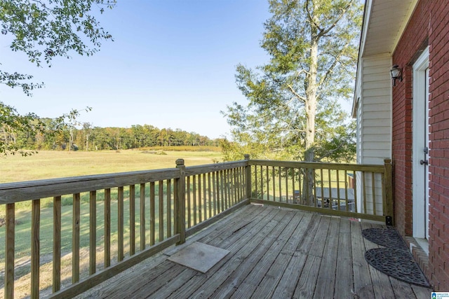 wooden deck with a yard