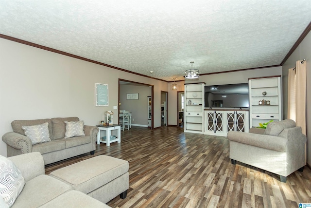 living room with a textured ceiling, crown molding, and hardwood / wood-style flooring