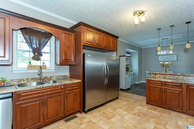 kitchen featuring ornamental molding, decorative light fixtures, stainless steel appliances, and sink